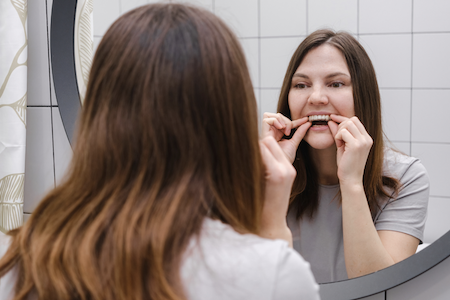 woman flossing