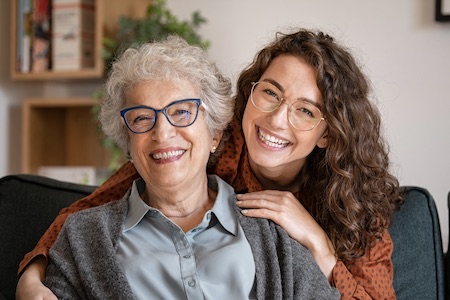 Woman advises her mouth to get an oral cancer screening.