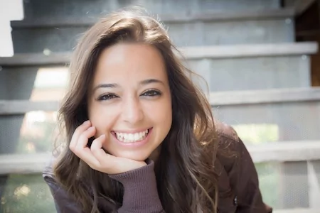 Woman from Colleyville shows off her new porcelain dental crown.