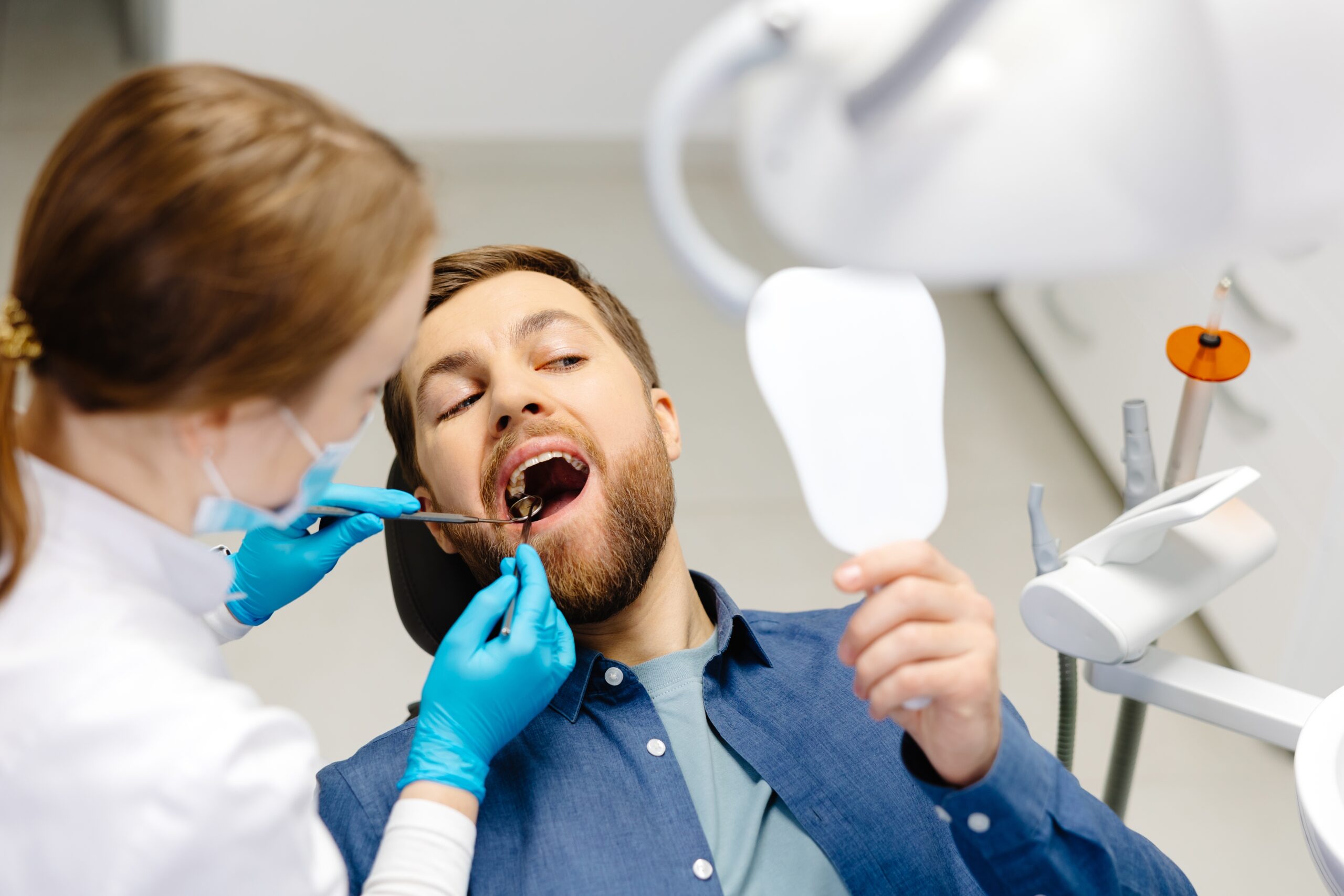 man undergoing a dental exam in Grapevine