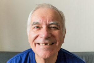 older man smiling, showing the large gap in his smile