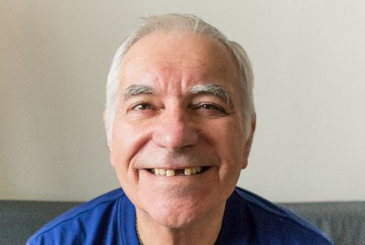 older man smiling, showing the large gap in his smile
